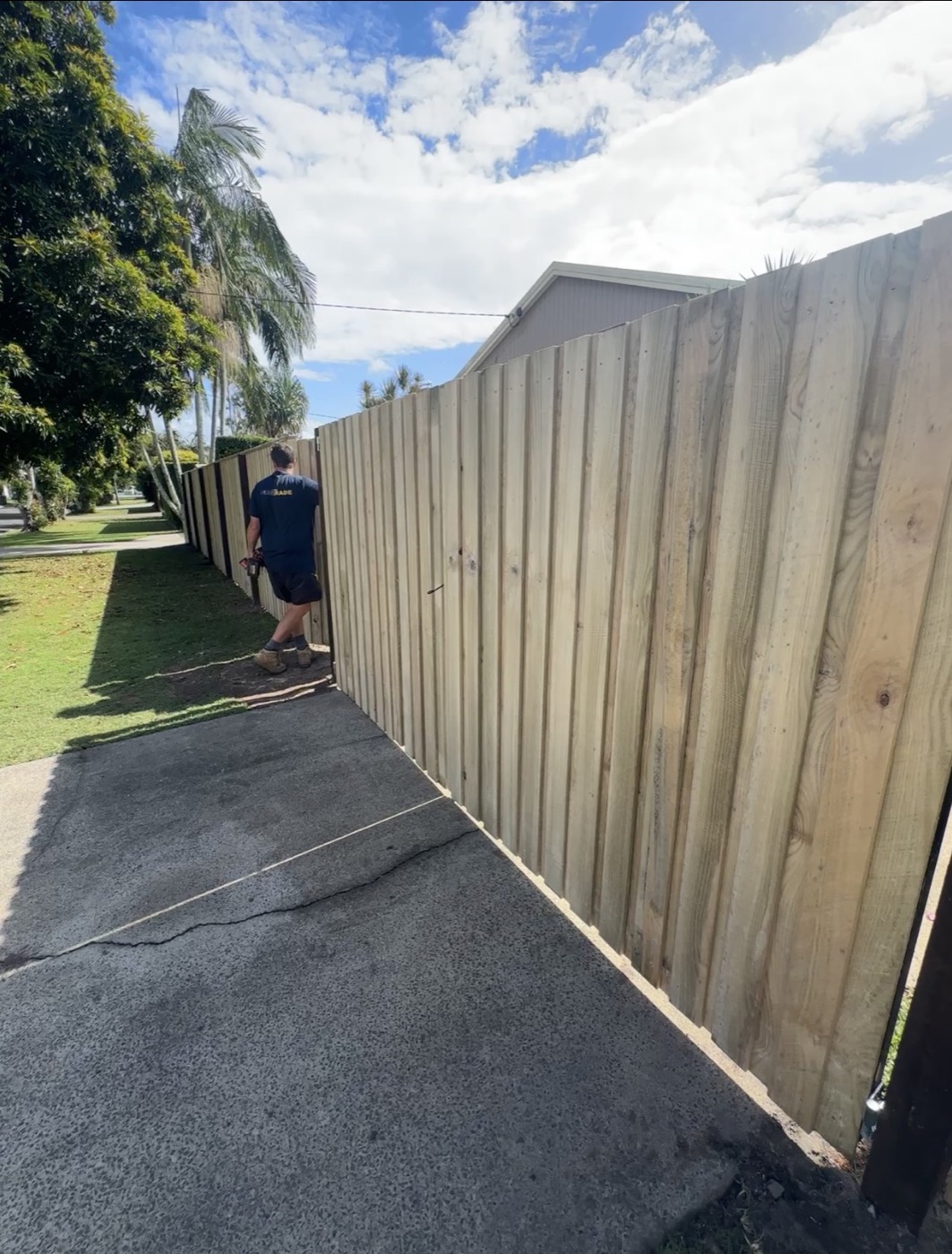 A finished timber paling fence built by CoasTrade