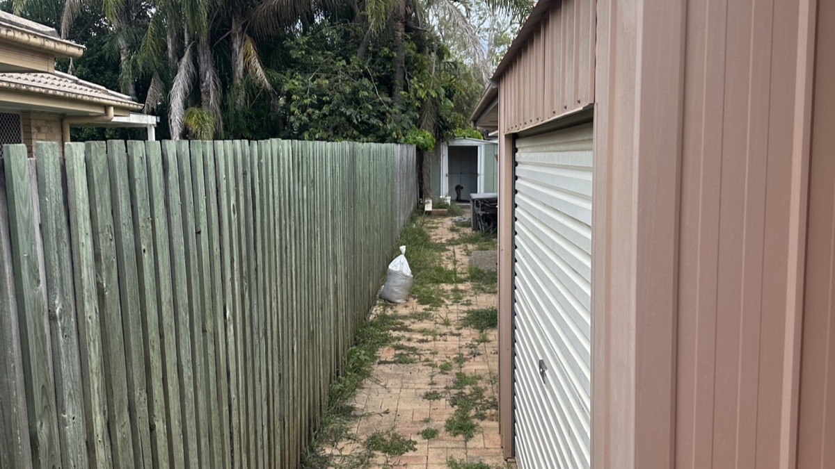 Old fence in Currimundi before CoasTrade replaced it